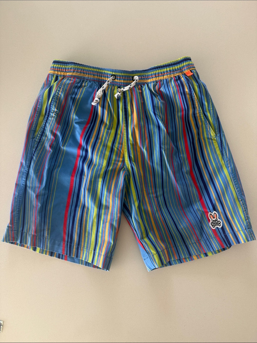 Psycho Bunny kids Blue Multi-Stripe Swim Trunks with Red & Yellow Accents